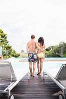 Young couple near swimming pool