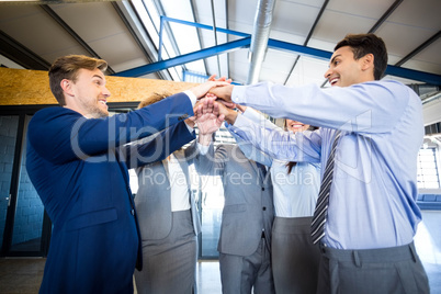 Businesspeople hands stacked over each other