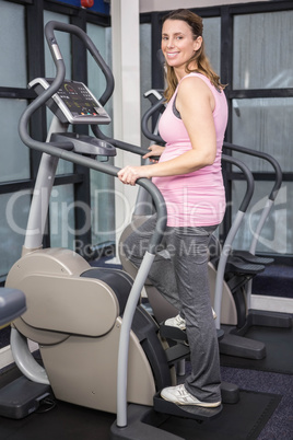 Pregnant woman on crosstrainer