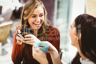 Friends chatting over coffee