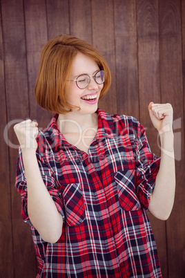 smiling hipster woman celebrating a victory