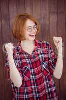smiling hipster woman celebrating a victory