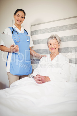 Portrait of nurse and senior woman