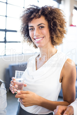 Businesswoman having a glass of water
