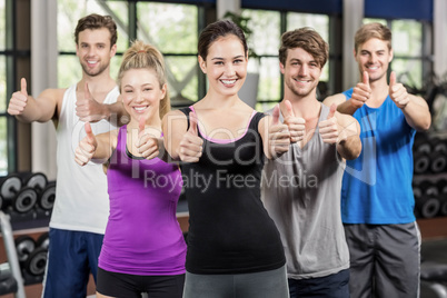 Fitness class showing thumbs up