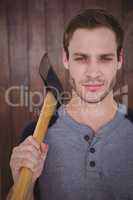 Handsome hipster holding an axe