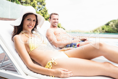 Young couple near swimming pool