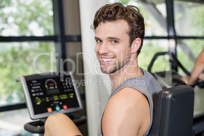 Fit man doing exercise bike