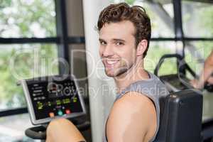 Fit man doing exercise bike