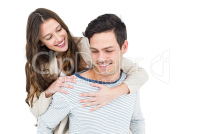 Man giving piggy back to his girlfriend