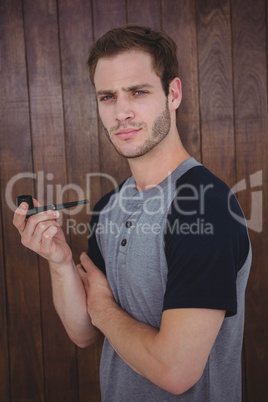 Handsome hipster smoking pipe