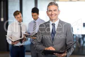 Close-up of businessman with his organizer