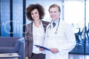 Doctor and colleague looking at camera