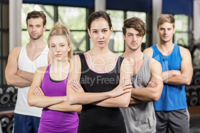 Fitness class with crossed arms