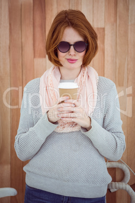 Red haired hipster drinking coffee