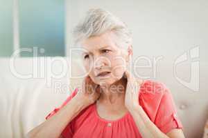 Senior woman suffering from neck pain