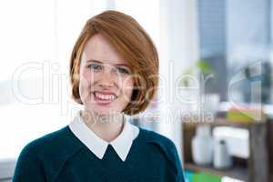 smiling hipster business woman looking at the camera