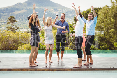 Happy young friends having drinks