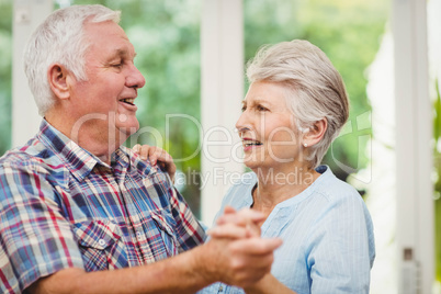 Happy senior couple dancing