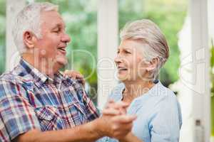 Happy senior couple dancing