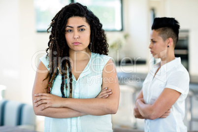 Unhappy lesbian couple ignoring each other