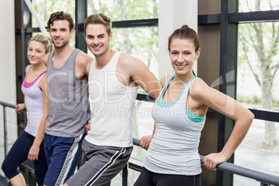 Fit people posing together