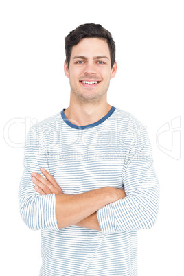Smiling man with arm crossed