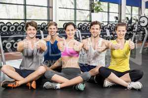 Fitness class showing thumbs up