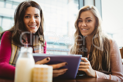 Friends using tablet together