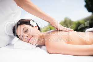 Woman receiving a back massage from masseur