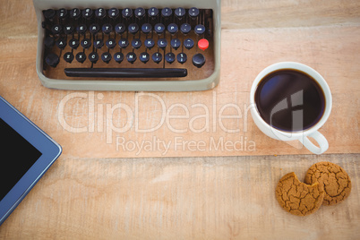 View of old typewriter and coffee