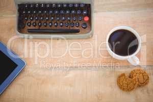 View of old typewriter and coffee