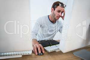 Tired man working on computer