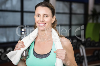 Smiling blonde standing with towel around neck