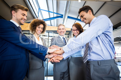 Businesspeople hands stacked over each other