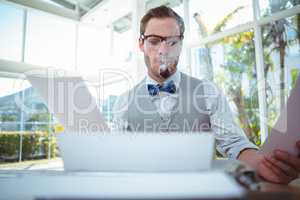 Handsome man using old fashioned typewriter