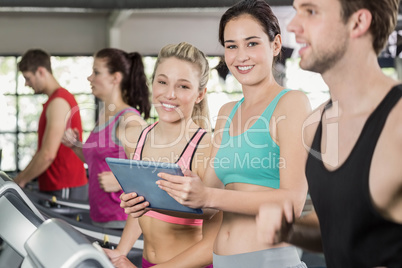 Athletic women looking at tablet