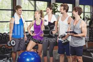 Fit people with sports equipment