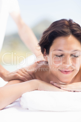 Woman receiving a back massage from masseur