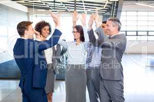 Happy business team high fiving