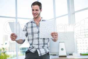 Hipster man looking at document