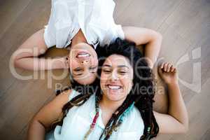 Lesbian couple lying on floor