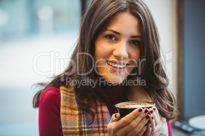 Woman drinking a cup of coffee