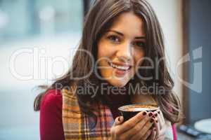 Woman drinking a cup of coffee