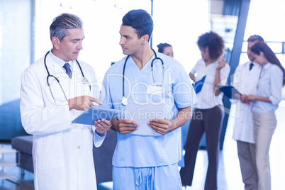 Doctor examining medical report and having a discussion