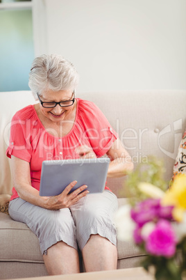 Senior woman using digital tablet