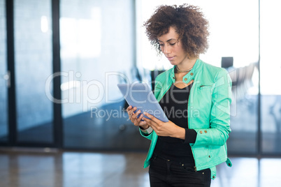 Young woman using digital tablet