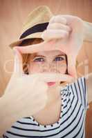 blue eyed hipster woman looking through her hand