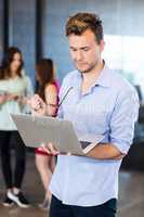 Man using a laptop in office