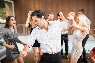 Group of young friends dancing